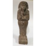 AN EGYPTIAN ALABASTER SHABTI FIGURE Carved as a Pharaoh with hieroglyphs to front and rear. (