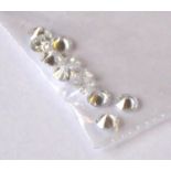 A COLLECTION OF LOOSE ROUND CUT DIAMONDS Comprising ten 3.8mm stones.