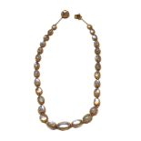 A VICTORIAN YELLOW METAL AND MOON STONE NECKLACE The strand of oval cabochon cut stones with a