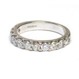 AN 18CT WHITE GOLD HALF ETERNITY RING SET WITH ELEVEN DIAMONDS (size L). (weight approx 4g)