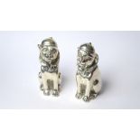 A PAIR OF CONTINENTAL SILVER NOVELTY DOG SALT AND PEPPER POTS Wearing caps and collars, marked .800.
