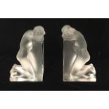 LALIQUE, A BOXED LARGE PAIR OF FIGURAL FROSTED AND CLEAR GLASS BOOKENDS Titled 'Reverie', kneeling