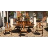 AN EARLY 20TH CENTURY BURR WALNUT QUEEN ANNE REVIVAL DINING ROOM SUITE comprising of d end table