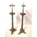 A PAIR OF VICTORIAN GOTHIC REVIVAL BRASS TABLE LAMPS Converted from candlesticks, the turned columns