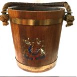 A 19TH CENTURY OAK AND LEATHER NAVAL FIRE BUCKET Having leather clad rope handle, brass banding