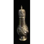 A CASED LARGE VICTORIAN SILVER SUGAR CASTER Done top with embossed scrolled decoration, in fitted
