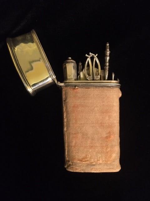 A RARE 18TH CENTURY WHITE METAL AND VELVET ETUI Containing nine implements and oriental velvet