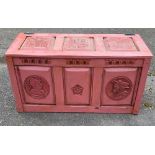 AN EARLY 20TH CENTURY FRENCH PAINTED OAK PANELLED COFFER Carved with coats of arms and facial