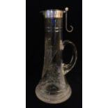ELKINGTON, AN EARLY 20TH CENTURY SILVER AND CUT GLASS CLARET JUG Having plain silver mounts,