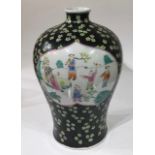 A CHINESE FAMILLE NOIR PORCELAIN BALUSTER VASE With figures in a garden on black ground.