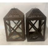 A PAIR OF PATINATED PIERCED IRON STORM LANTERNS. (38cm)