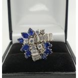 A VINTAGE 18CT GOLD, DIAMOND AND SAPPHIRE RING Having an arrangement of brilliant and baguette cut