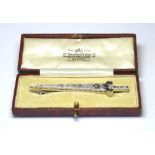 A VINTAGE 18CT WHITE GOLD AND DIAMOND SET DAGGER BROOCH The arrangement of graduating round cut