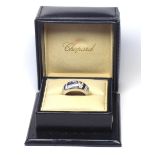 CHOPARD, AN 18CT WHITE GOLD, SAPPHIRE AND DIAMOND BAND RING Heart form sapphire flanked with