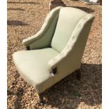 A LATE VICTORIAN BOUDOIR ARMCHAIR With button back swept arms in a green fabric upholstery. (66cm