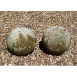 A PAIR OF ANTIQUE WHITE STONE SPHERES. (23cm)