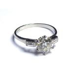 A PLATINUM RING SET WITH A 1.68 CENTRAL DIAMOND On baguette diamond shoulders (size N). weight