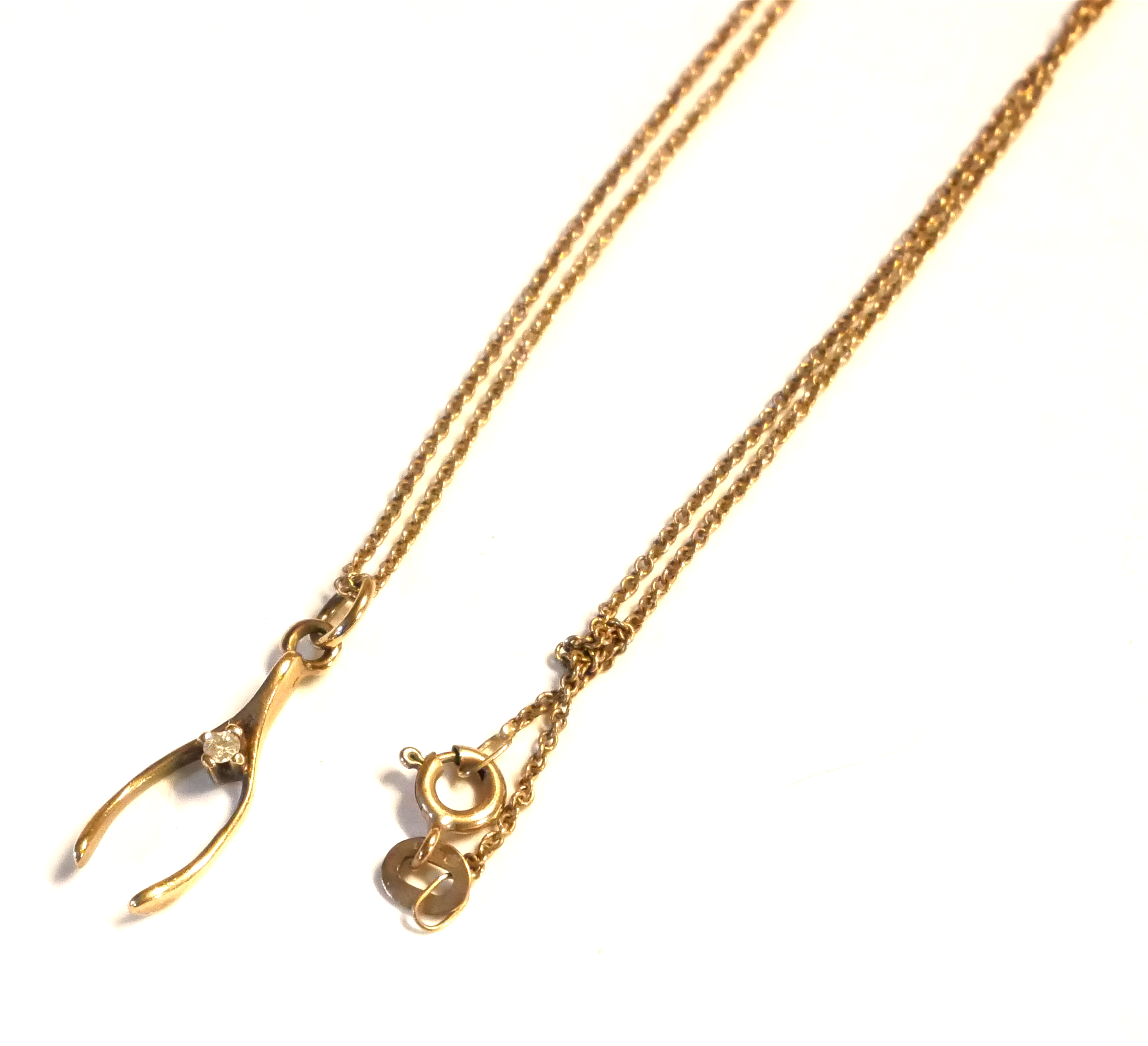 A VINTAGE 9CT GOLD AND DIAMOND PENDANT WISHBONE NECKLACE With a five link chain, together with two - Image 2 of 4