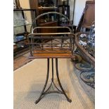 A LARGE 19TH CENTURY VICTORIAN WALNUT AND BRASS NEWSPAPER STAND The revolving top supported on three
