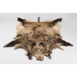 A 21ST CENTURY WILD BOAR SKIN RUG. (l 170cm x w 145cm)