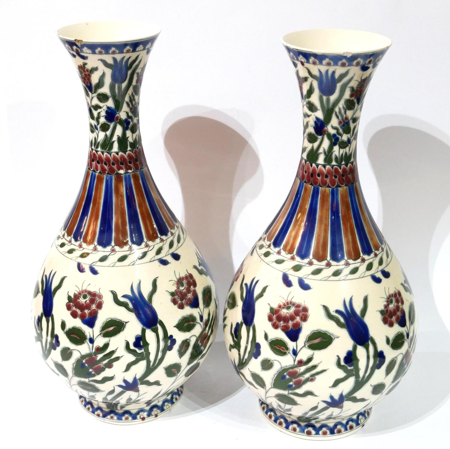A PAIR OF LATE 19TH CENTURY MONUMENTAL HUNGARIAN ZSOLNAY-PÉCS POTTERY PYRIFORM VASES On a short