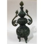 A CHINESE BRONZE DOUBLE GOURD FORM KORO AND COVER With twin dragon handles and pierced floral