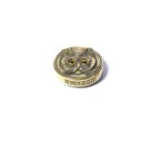 A BRASS NOVELTY VESTA CASE Twin sided, modelled as a cat's head with glass eyes. (approx 4cm) (