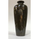 A JAPANESE MEIJI BRONZE GOLD AND SILVER INLAID COCKEREL VASE Tapering form with inlaid silver tail