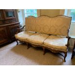 A 19TH CENTURY FRENCH REGENCY DESIGN WALNUT AND PARCEL GILT CARVED WOOD THREE SEAT SETTEE