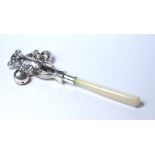 A SILVER AND MOTHER OF PEARL NOVELTY CHILD'S RATTLE Modelled as a standing teddy bear with mother of