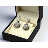 A PAIR OF 18CT WHITE GOLD AND DIAMOND DROP EARRINGS Geometric form with diamond target drops. (