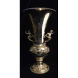 ELKINGTON AND CO., AN EARLY 20TH CENTURY SILVER FIGURAL FLOWER VASE Having twin mermaid handles