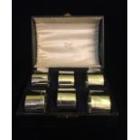A CASED SET OF SIX EARLY 20TH CENTURY SILVER SERVIETTE RINGS Plain form in fitted velvet lined