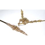 A 14K GOLD BAGUETTE AND MARQUISE DIAMOND ENCRUSTED NECKLACE AND MATCHING BRACELET. (necklace