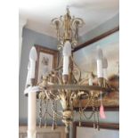 19TH CENTURY FRENCH NEOCLASSICAL GILT BRONZE AND ORMOLU EIGHT BRANCH CHANDELIER Decorated with