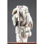 A FINE 19TH CENTURY 'FOUR EVILS' JAPANESE NETSUKE IVORY CARVING OF WINE, WOMEN, GAMBLING AND SONG