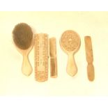 A COLLECTION OF EARLY 20TH CENTURY IVORY ITEMS To include cribbage board, brush and mirror set.