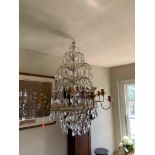 A LARGE DECORATIVE FRENCH DESIGN GILT METAL AND GLASS TWELVE BRANCH CHANDELIER. (drop 90cm x