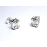 A PAIR OF 18K WHITE GOLD STUD EARRINGS Set with 1ct of baguette cut diamonds.