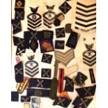 A COLLECTION OF CLOTH ASSORTED MILITARY BADGES Various designs. (approx 100)