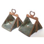 A PAIR OF 19TH CENTURY COPPER AND IRON MILITARY RIDING STIRRUPS. (20cm x 18cm)