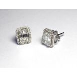 A PAIR OF 18K WHITE GOLD STUD EARRINGS SET WITH 1.12 BAGUETTE DIAMONDS. (1.1cm x 0.9cm) Colour G H1