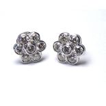 A PAIR OF 18K WHITE GOLD DAISY SHAPED EARRINGS, SET WITH 3CT OF ROUND BRILLIANT CUT DIAMONDS. (