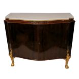 AN EARLY 20TH CENTURY MAHOGANY AND PARCEL GILT SIDE CABINET Serpentine form, with white marble top