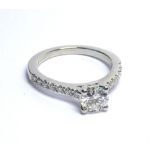 A PLATINUM RING SET WITH A .95 CT CENTRAL STONE On diamond shoulders (size M). weight approx 6gm.