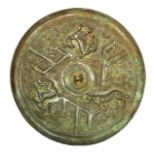 A CHINESE BRONZE ARCHAIC STYLE MIRROR With an embossed decoration of animals. (approx 21cm)