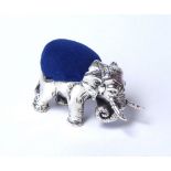A SILVER NOVELTY PIN CUSHION Modelled as an elephant with blue velvet insert, marked .925. (approx