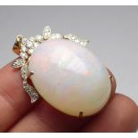 A 14K GOLD AND DIAMOND PENDANT SET WITH A 48CT CABOCHON OPAL. weight approx 12.5gm.