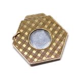 AN ART DECO 9CT GOLD AND STEEL CIGAR CUTTER Hexagonal form with engraved decoration. (approx 3.