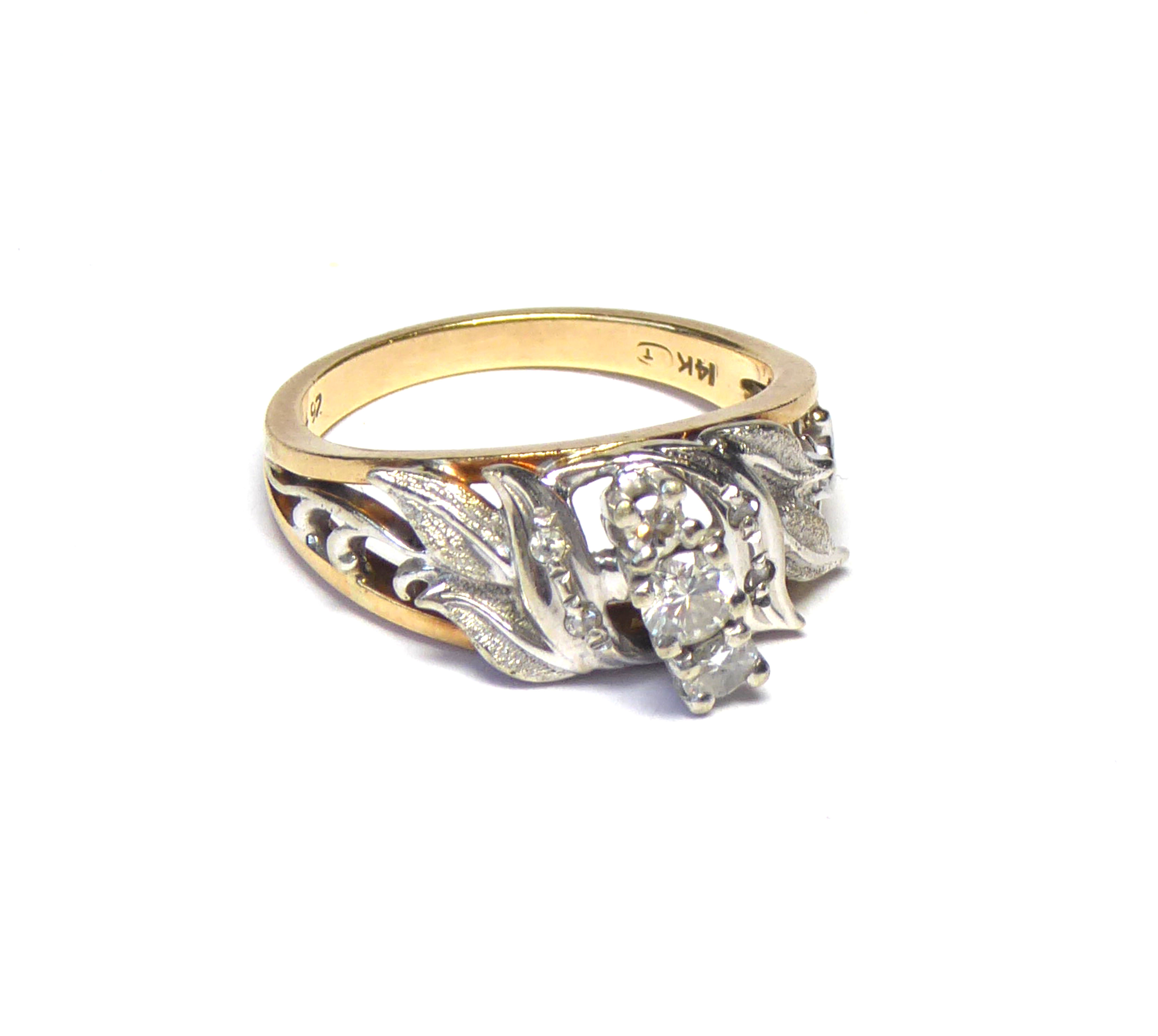 A 14K GOLD AND DIAMOND THREE STONE RING The graduated stones in a white gold pierced mount on yellow - Image 2 of 2